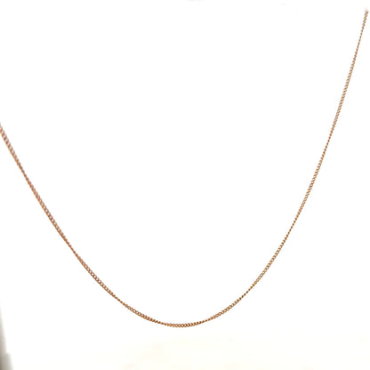 9ct yellow gold chain, 1.4g, unbranded, with a classic link design, shown in close-up on a white background.