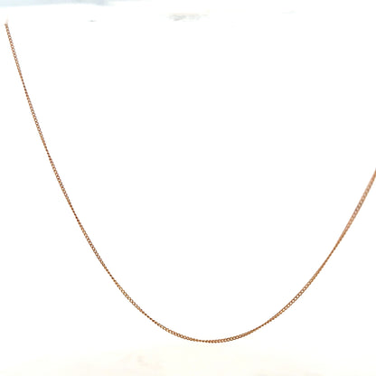 9ct yellow gold chain weighing 1.4g, featuring a classic link design, unbranded jewelry accessory.