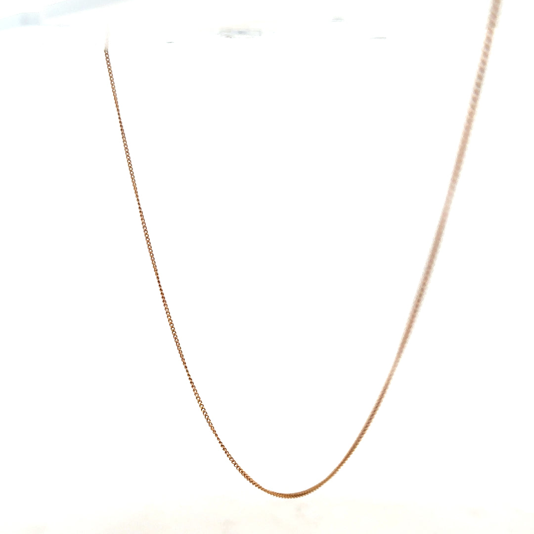 9ct yellow gold chain weighing 1.4g, unbranded, with a delicate link design, shown against a neutral background.