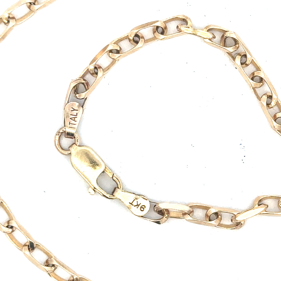 9ct yellow gold chain weighing 10.9g, displayed on a plain background, showcasing its classic design and polished finish.