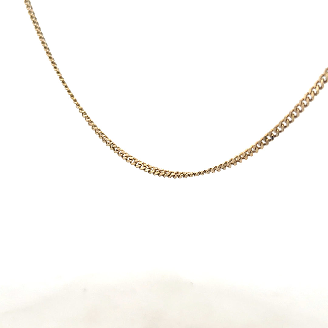9ct yellow gold chain weighing 11g, unbranded, with a detailed close-up of the shiny, intricate link design.