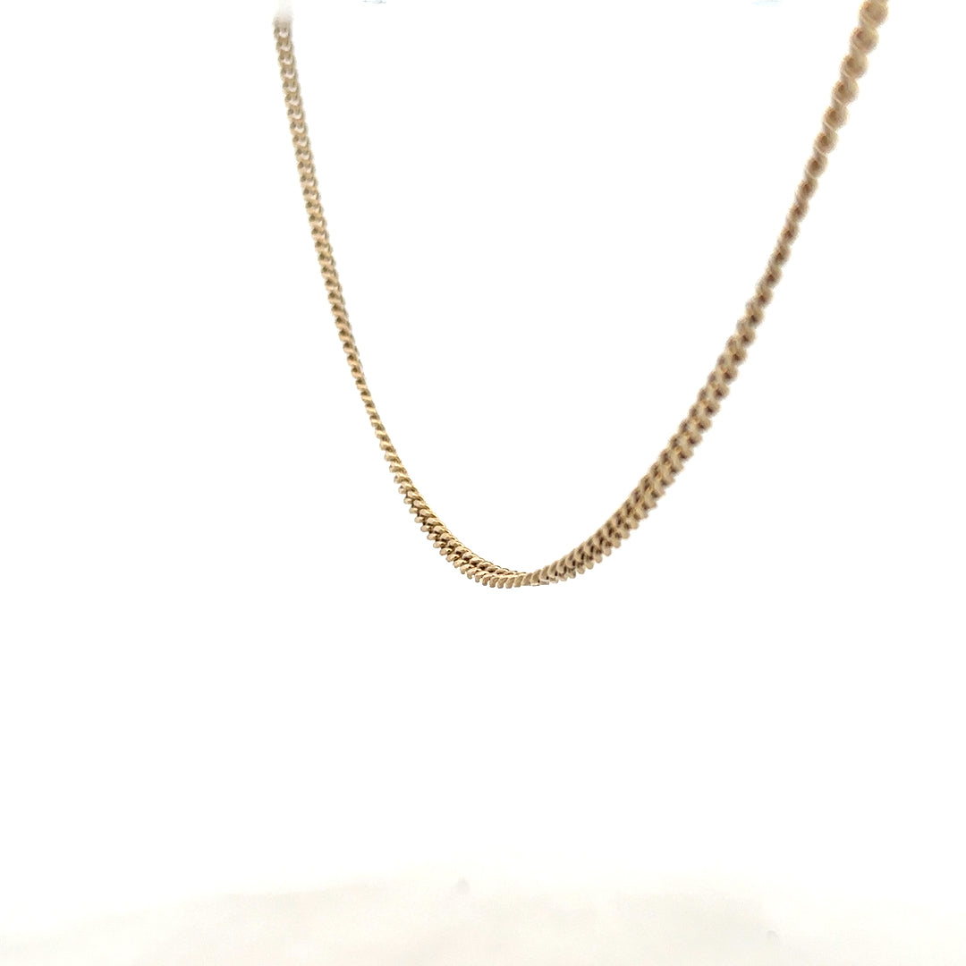 9ct yellow gold chain with 11g weight, showcasing a classic chain design in a close-up shot.