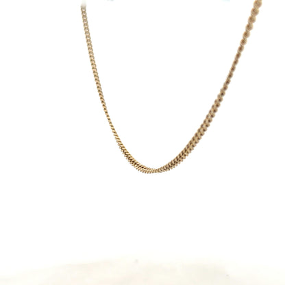 9ct yellow gold chain with 11g weight, showcasing a classic chain design in a close-up shot.