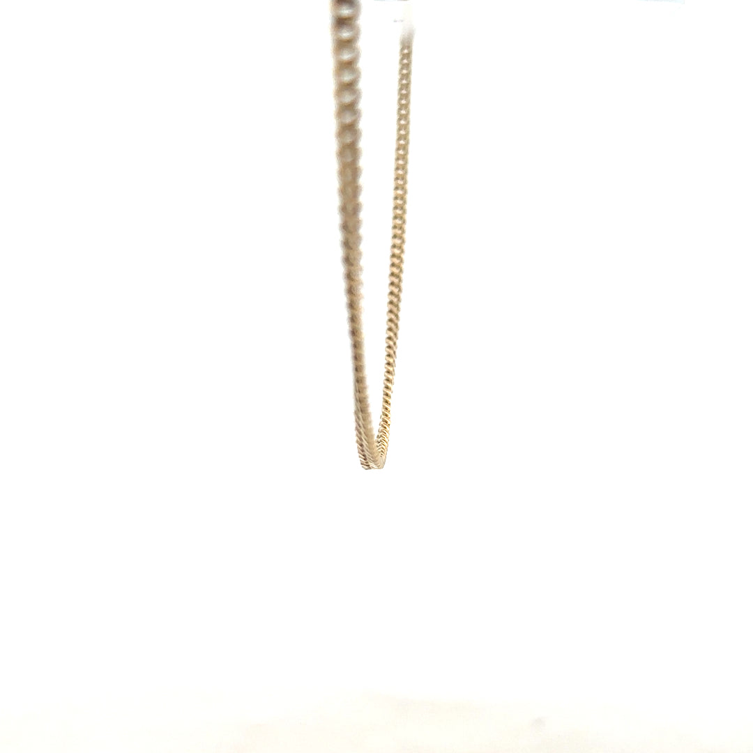 9ct yellow gold chain weighing 11g, unbranded, shown in a close-up image highlighting its fine craftsmanship and polished finish.