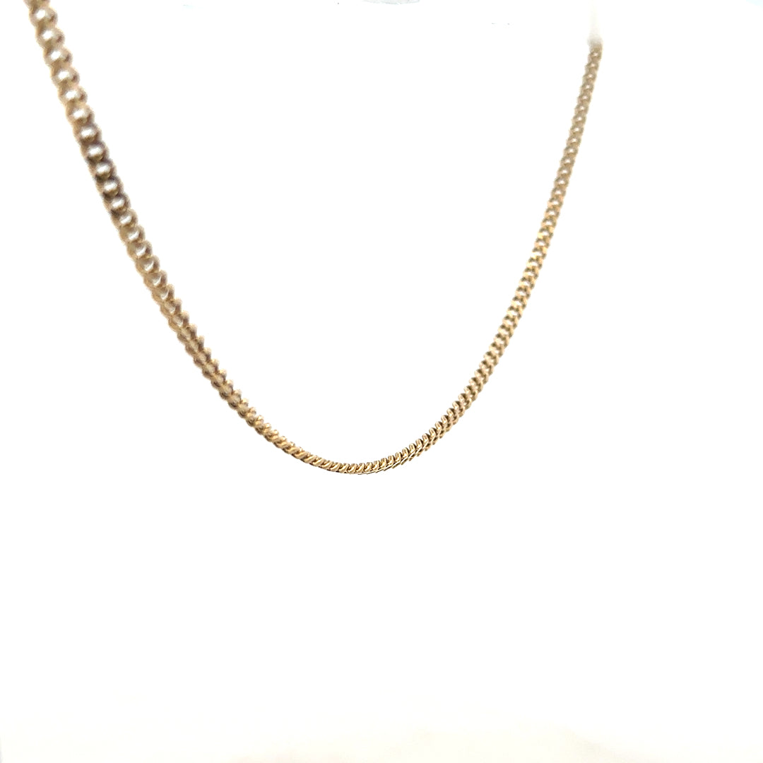 9ct yellow gold chain weighing 11g, unbranded, with a classic link design, shown in a close-up image.