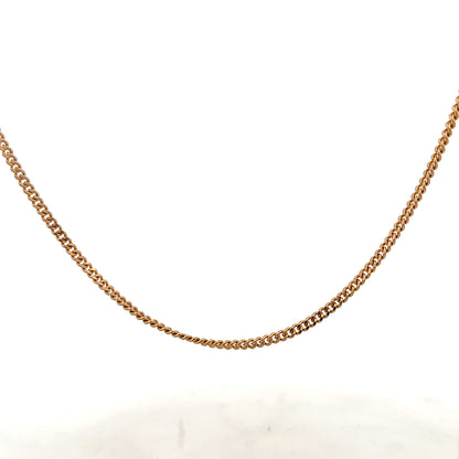 9ct yellow gold chain weighing 12.7g, unbranded jewelry piece with a classic design, shown in a close-up image.