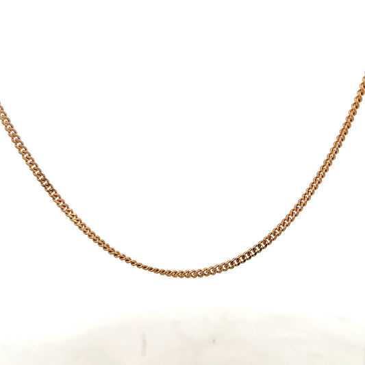 9ct yellow gold chain weighing 12.7g, unbranded jewelry piece with a classic design, shown in a close-up image.