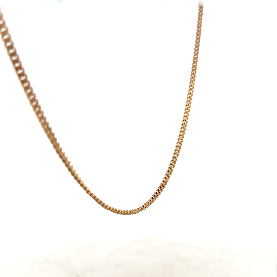 9ct yellow gold chain weighing 12.7g, featuring a classic link design, unbranded jewelry piece with a polished finish.