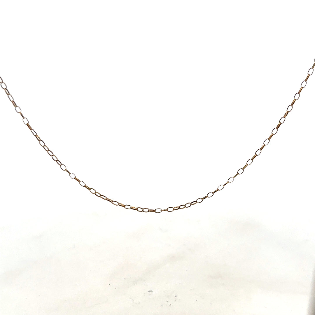 9ct yellow gold chain weighing 1g, unbranded jewelry accessory with a sleek design, shown in close-up image.