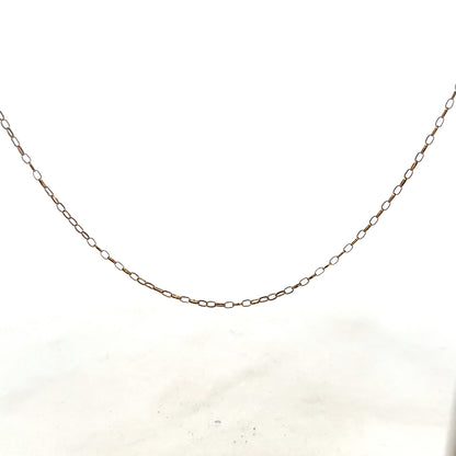 9ct yellow gold chain weighing 1g, unbranded jewelry accessory with a sleek design, shown in close-up image.
