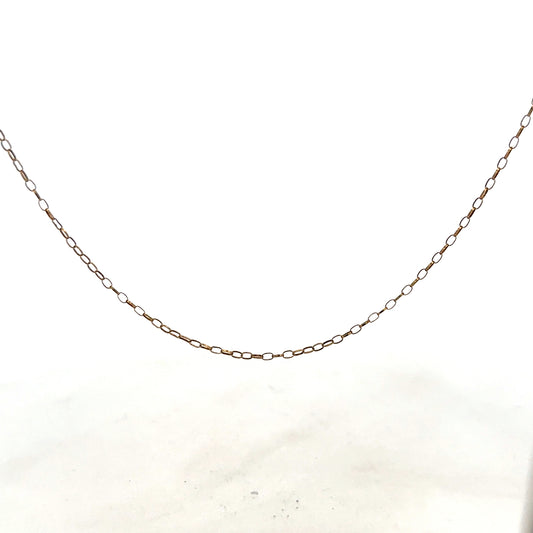 9ct yellow gold chain weighing 1g, unbranded jewelry accessory with a sleek design, shown in close-up image.