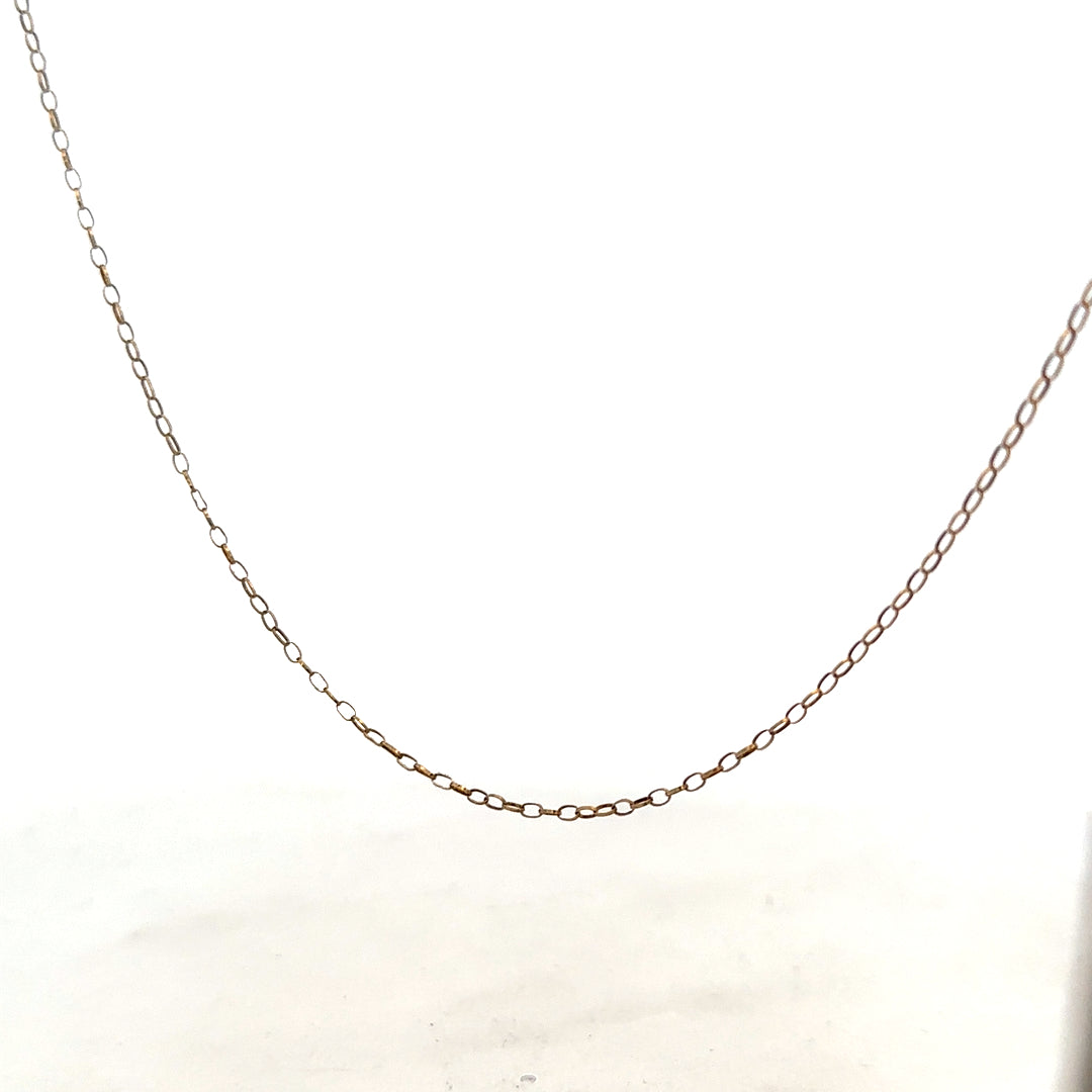 9ct yellow gold chain with 1g weight, showcasing a delicate, shiny gold jewelry piece on a neutral background.