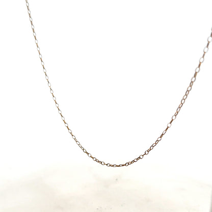 9ct yellow gold chain weighing 1g, unbranded, shown in a close-up image highlighting its fine link design.