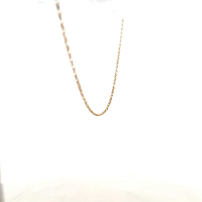 9ct yellow gold chain weighing 2.2g, unbranded jewelry with a classic link design, shown in a close-up image.