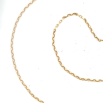 9ct yellow gold chain weighing 2.4g, unbranded, with a detailed close-up of the jewelry showing its fine link design.