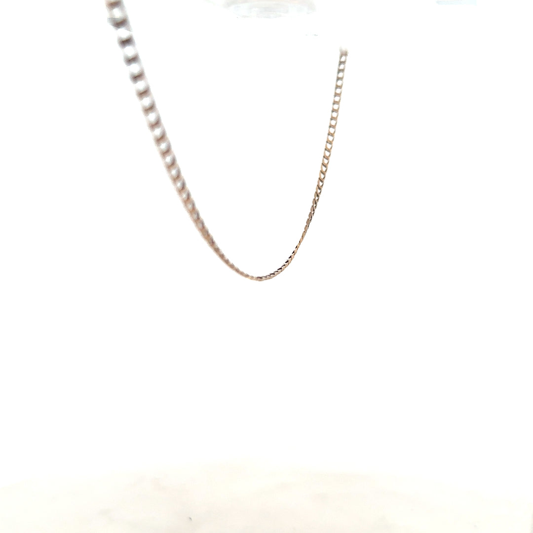 9ct yellow gold chain weighing 3.1g, unbranded, with a classic link design, shown in a close-up image.