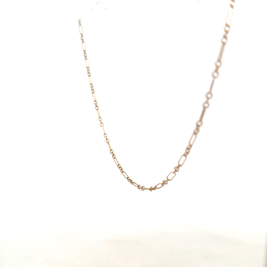 9ct yellow gold chain weighing 3.3g, unbranded jewelry with a delicate link design, shown in a close-up image.