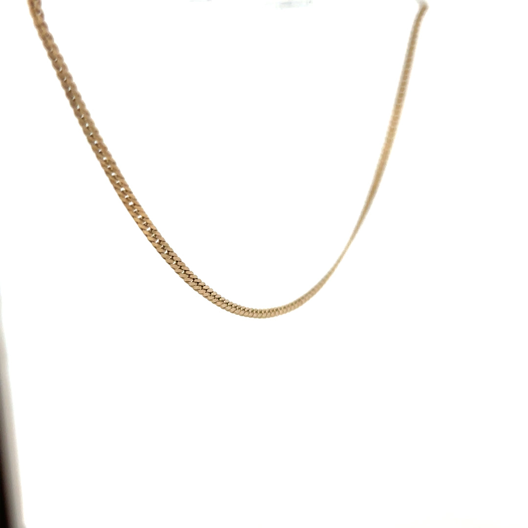 9ct yellow gold chain weighing 4.6g, unbranded jewelry with a classic link design, shown in a close-up image.