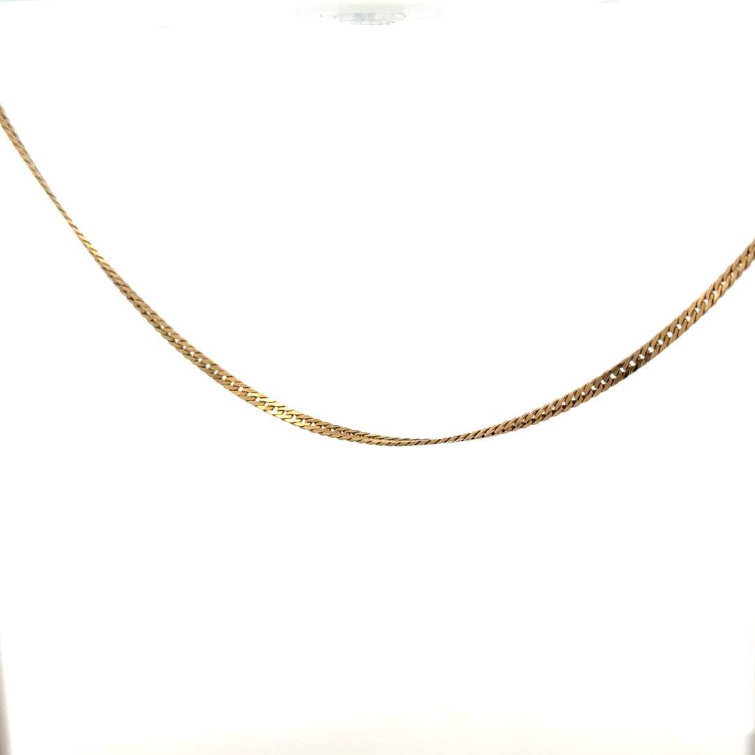 9ct yellow gold chain weighing 4.6g, unbranded, with a classic link design, shown lying flat on a neutral background.