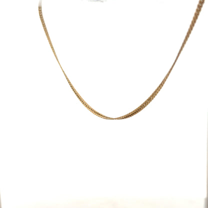 9ct yellow gold chain weighing 4.6g, unbranded, with a close-up of the smooth, shiny link design.