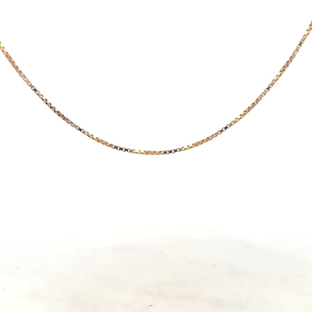 9ct yellow gold chain weighing 6.1g, unbranded, with a classic link design, shown laid flat against a plain background.