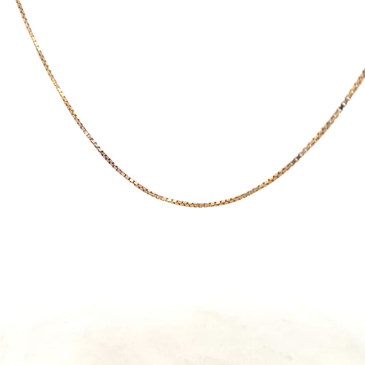 9ct yellow gold chain weighing 6.1g, featuring a classic link design, photographed against a plain background.