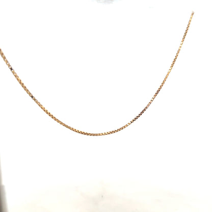 9ct yellow gold chain weighing 6.1g, unbranded, with a detailed close-up showing its fine link design and polished finish.