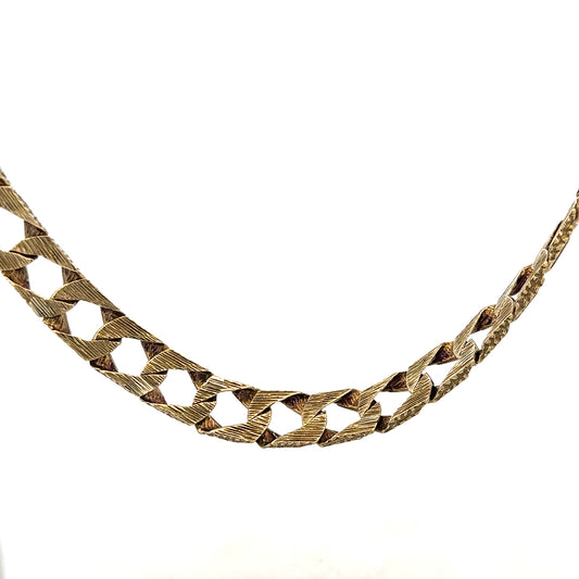 9ct yellow gold chain weighing 61.2g, unbranded jewelry with a polished finish and intricate link design.