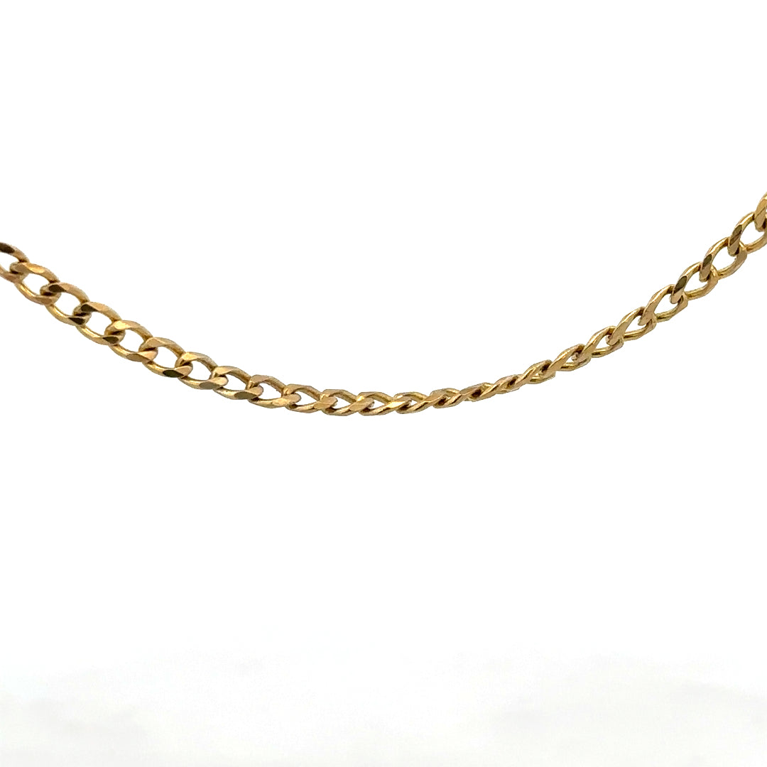 9ct yellow gold chain weighing 7.4g, unbranded, with a close-up view showing its polished links and elegant design.