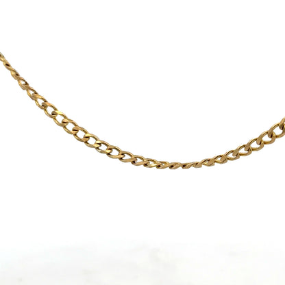 9ct yellow gold chain weighing 7.4g, unbranded jewelry piece with a classic design, displayed against a neutral background.