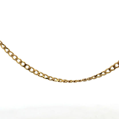 9ct yellow gold chain weighing 7.4g, unbranded, with a detailed close-up of the polished gold links.