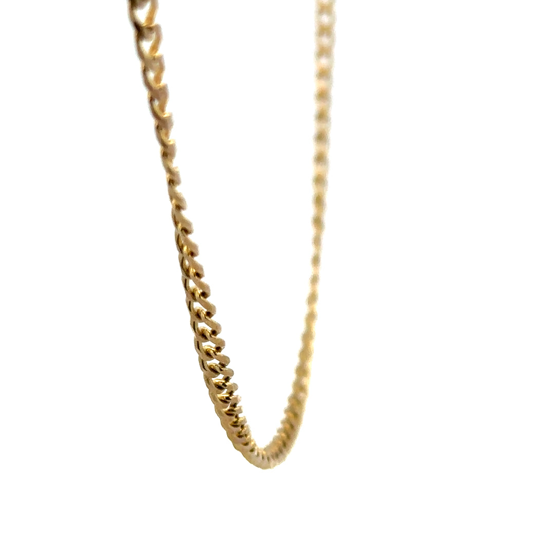 9ct yellow gold chain weighing 7.4g, unbranded, with a detailed close-up of the link design and polished finish.