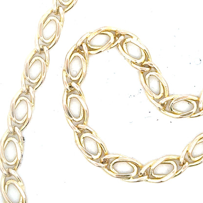 9ct yellow gold chain, 7.8g, unbranded, with a classic link design, shown in a close-up image highlighting its shine and craftsmanship.