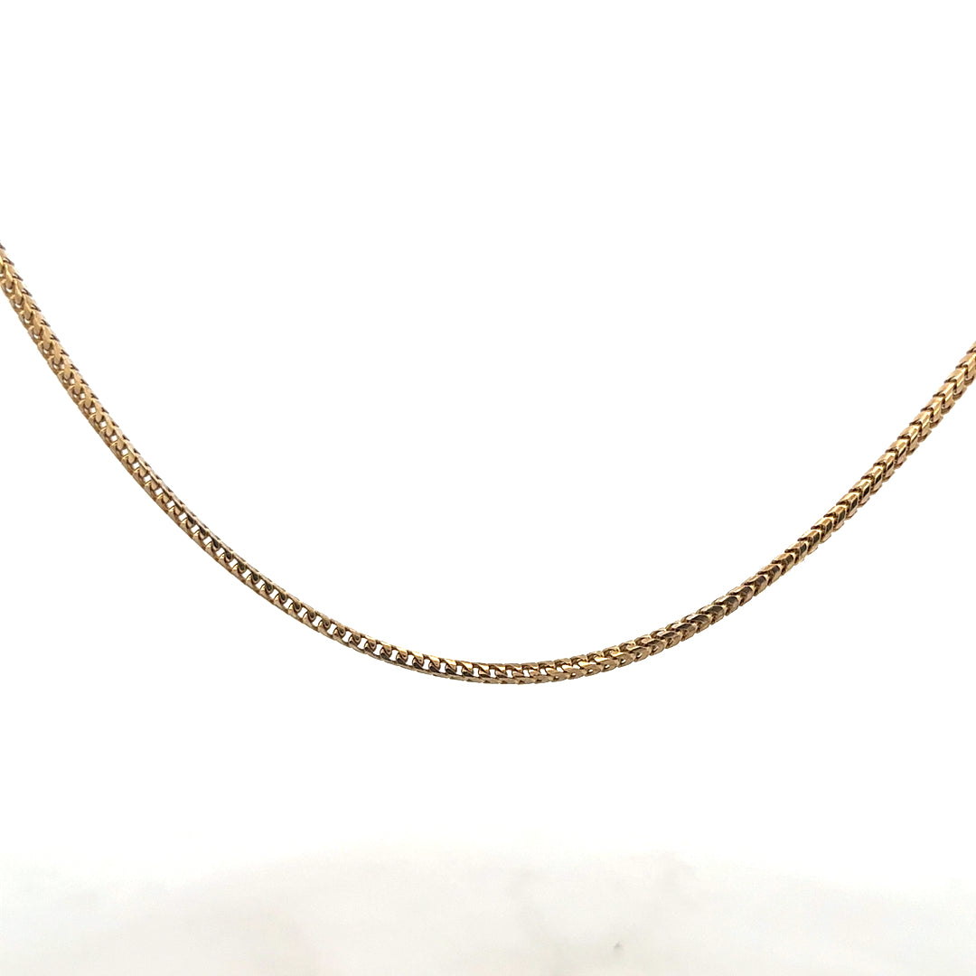 9ct yellow gold chain weighing 9.2g, featuring a classic link design, unbranded jewelry accessory with polished finish.