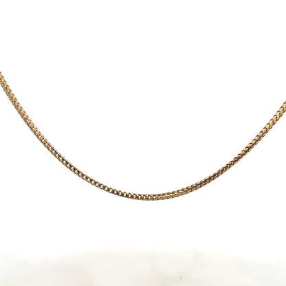 9ct yellow gold chain weighing 9.2g, featuring a classic link design, unbranded jewelry accessory with polished finish.