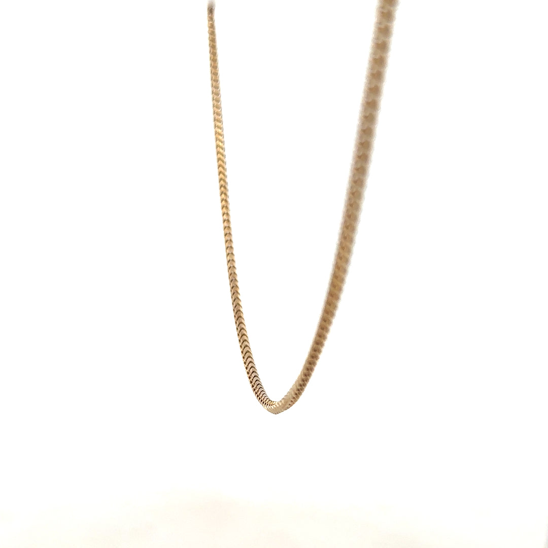 9ct yellow gold chain weighing 9.2g, unbranded, with a close-up view showing the chain's links and polished finish.