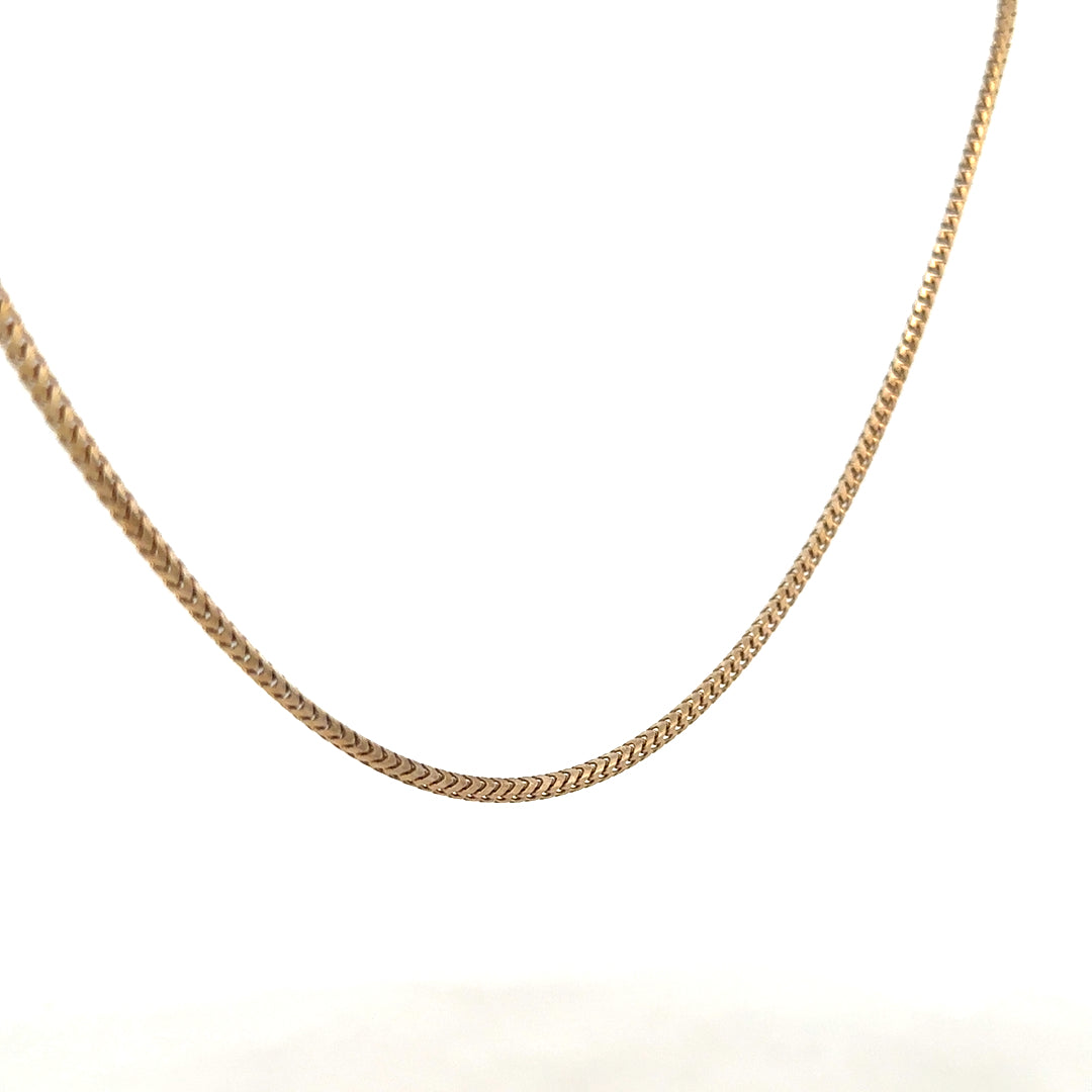9ct yellow gold chain weighing 9.2g, unbranded jewelry with a classic link design, displayed on a neutral background.