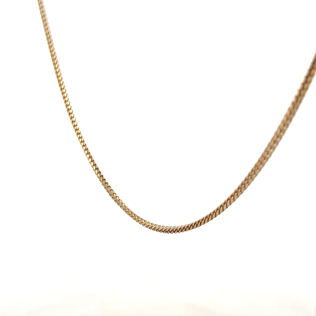 9ct yellow gold chain weighing 9.2g, displayed on a neutral background, showcasing its fine link design and polished finish.