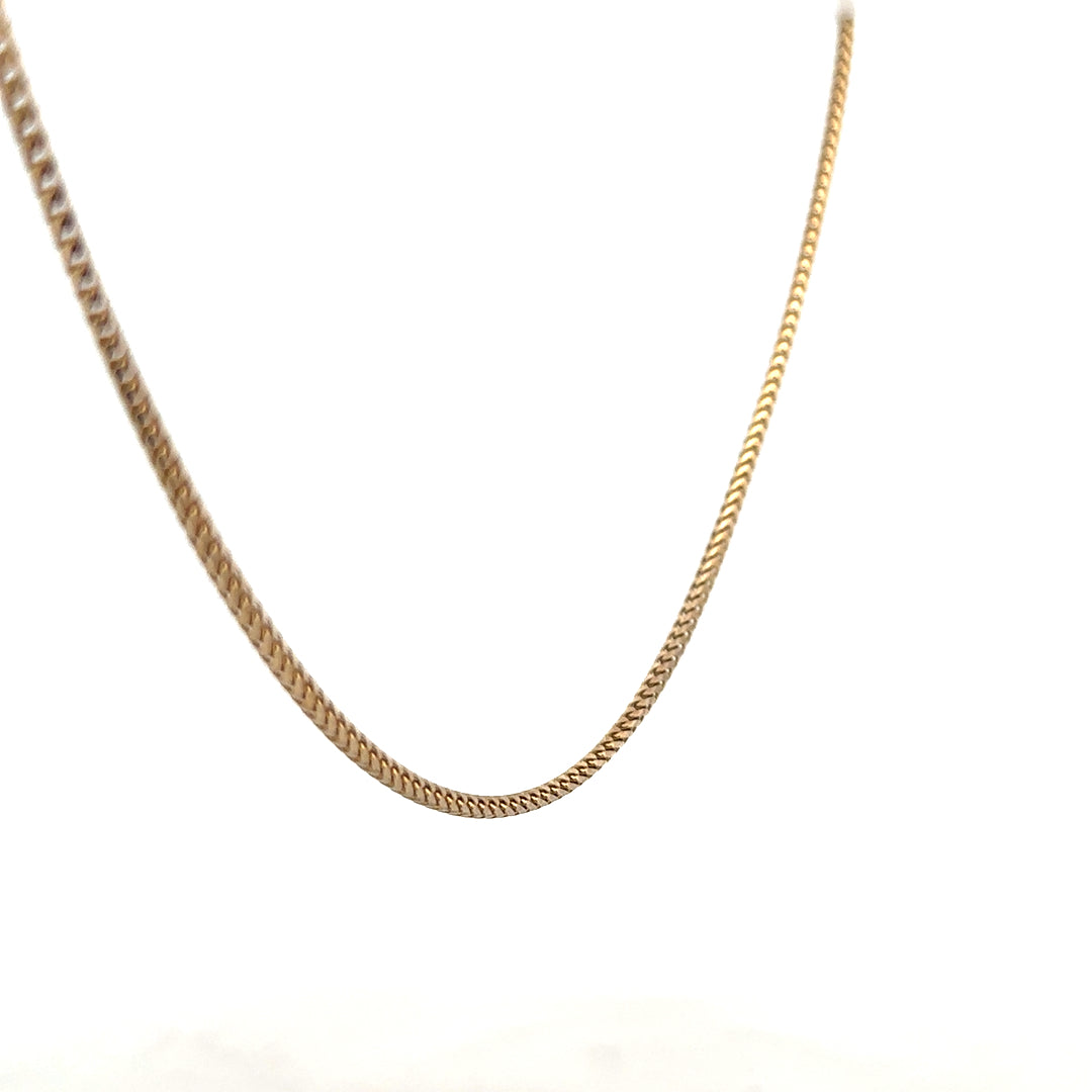 9ct yellow gold chain weighing 9.2g, unbranded, with a classic link design, shown in a close-up image.