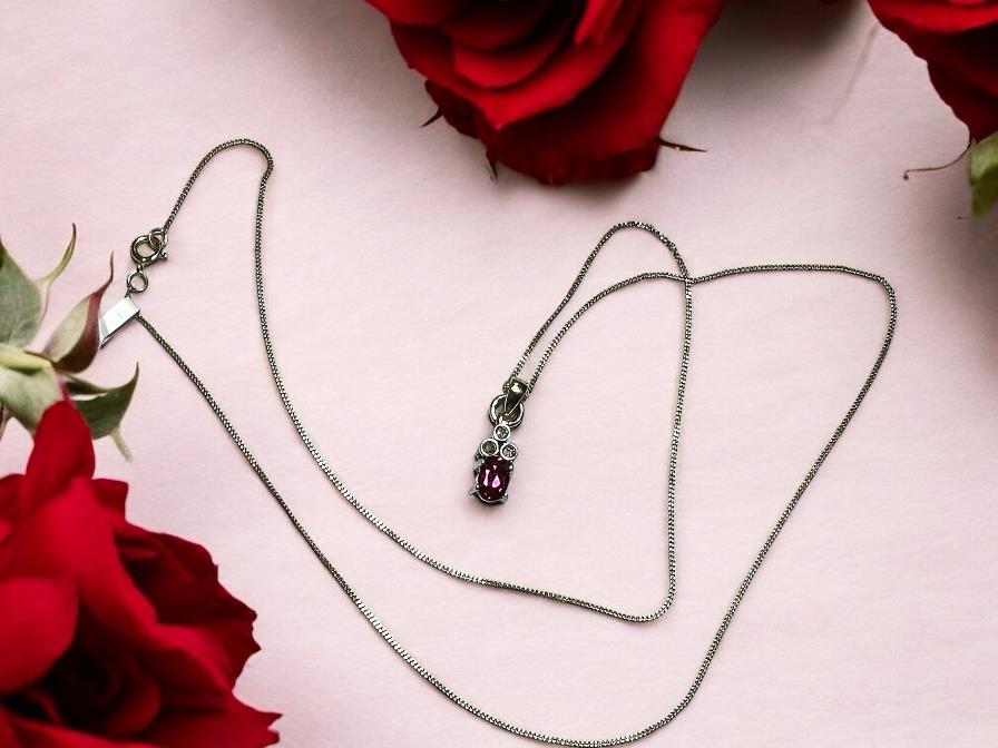 9ct yellow gold chain with diamond pendant, showcasing a delicate design and sparkling diamonds on a fine jewelry chain.