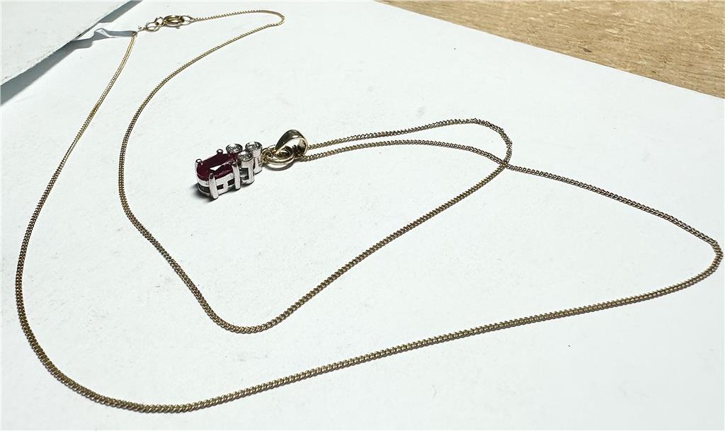 9ct yellow gold chain with diamond pendant, weighing 1.9g, featuring a delicate design and sparkling gemstone.