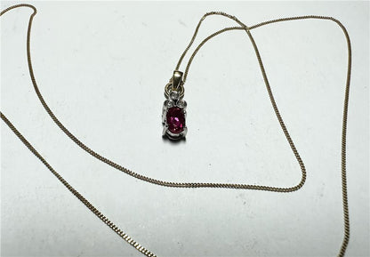 9ct yellow gold chain with a diamond pendant, weighing 1.9g, featuring a delicate design and sparkling gemstone.