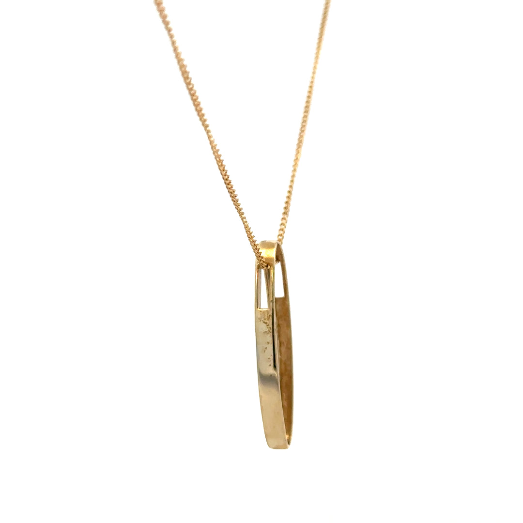 9ct yellow gold chain with a diamond pendant, showcasing a delicate design and sparkling gemstone on a white background.