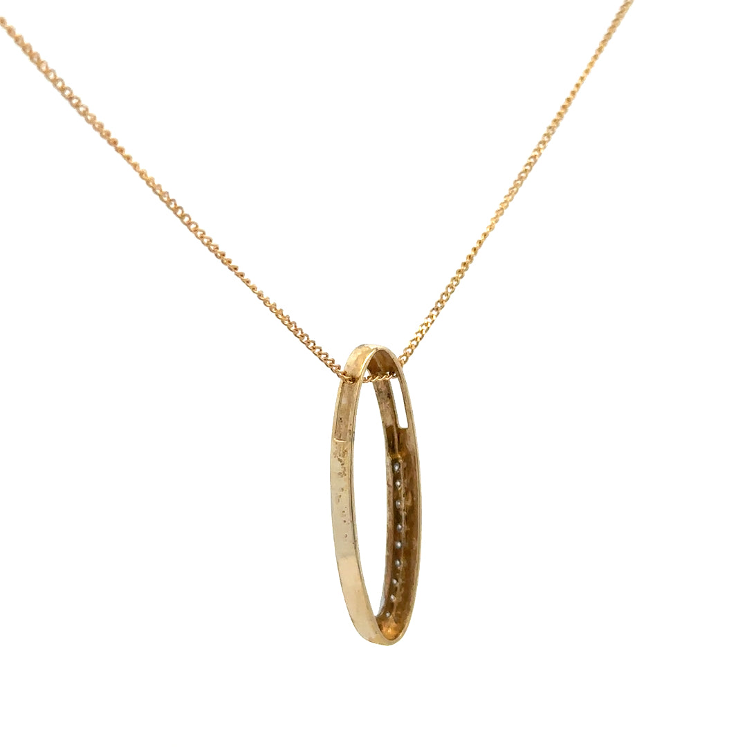 9ct yellow gold chain with diamond pendant, showcasing a delicate gold chain and sparkling diamond accent.