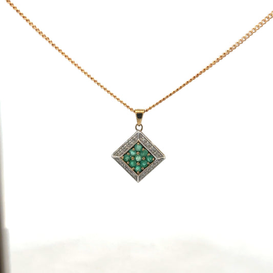 9ct yellow gold chain with emerald and diamond pendant, showcasing a delicate design and vibrant gemstones.