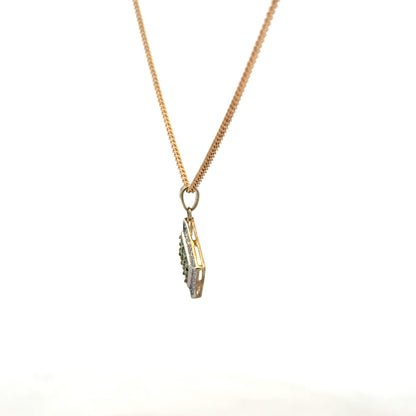 9ct yellow gold chain with emerald and diamond pendant, showcasing a detailed jewelry piece with vibrant gemstones and intricate design.