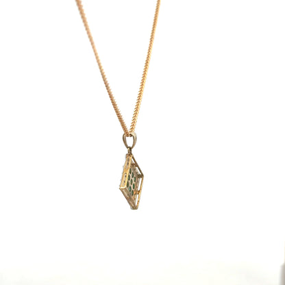 9ct yellow gold chain with emerald and diamond pendant, showcasing a delicate design and vibrant gemstones.