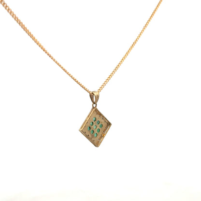 9ct yellow gold chain with emerald and diamond pendant, showcasing a delicate design and sparkling gemstones.
