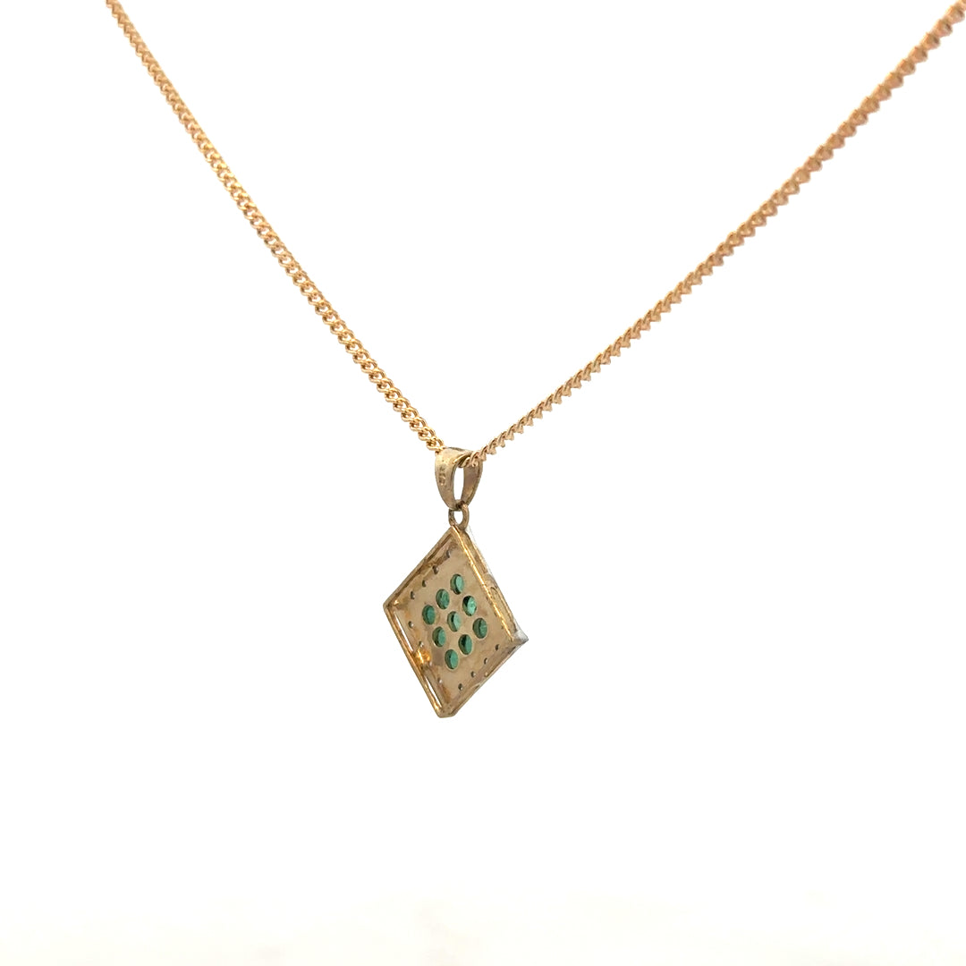 9ct yellow gold chain with emerald and diamond pendant, showcasing a delicate jewelry piece with vibrant gemstones and fine craftsmanship.