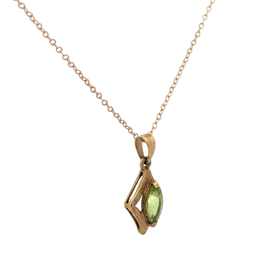 9ct yellow gold chain with pendant, unbranded, weighing 2.2g, showcasing the jewelry's fine detail and craftsmanship.